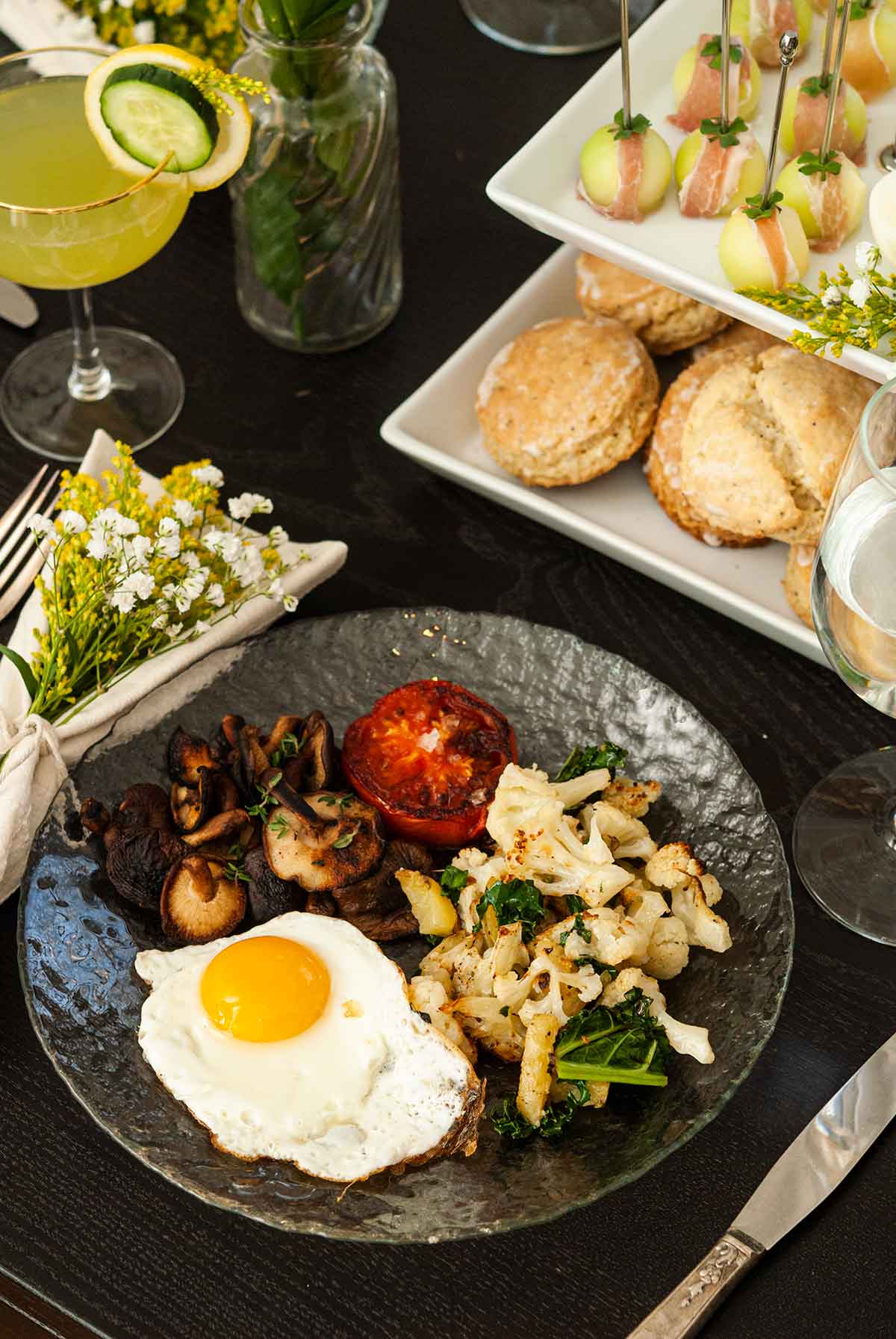 A plate of breakfast on a table.