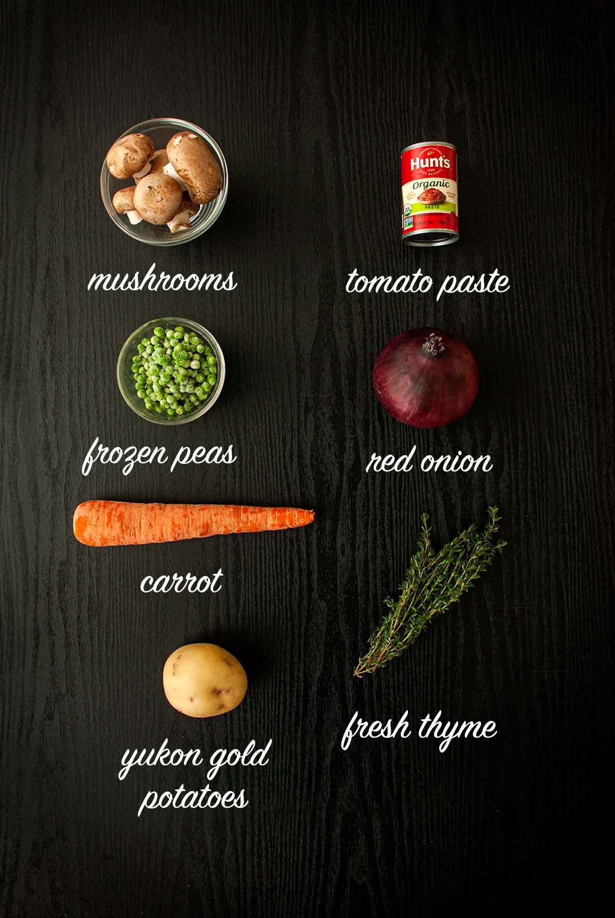 6 ingredients on a table with titles saying what they are.
