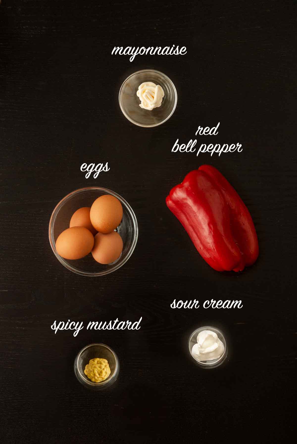 5 ingredients for making deviled eggs on a table with titles describing what they are.