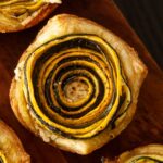 1 zucchini rosette on a wooden board.