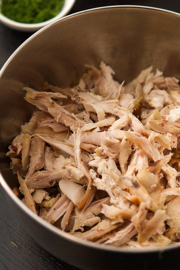 A bowl of shredded chicken.