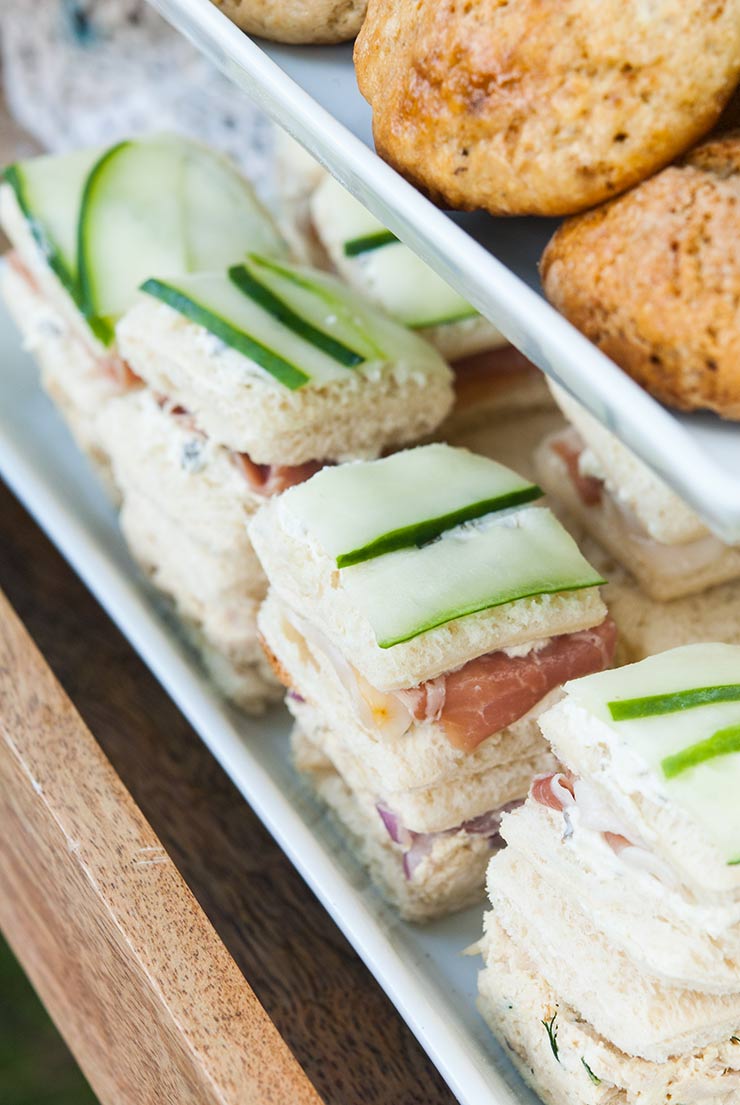 Cucumber sandwiches on a tray.