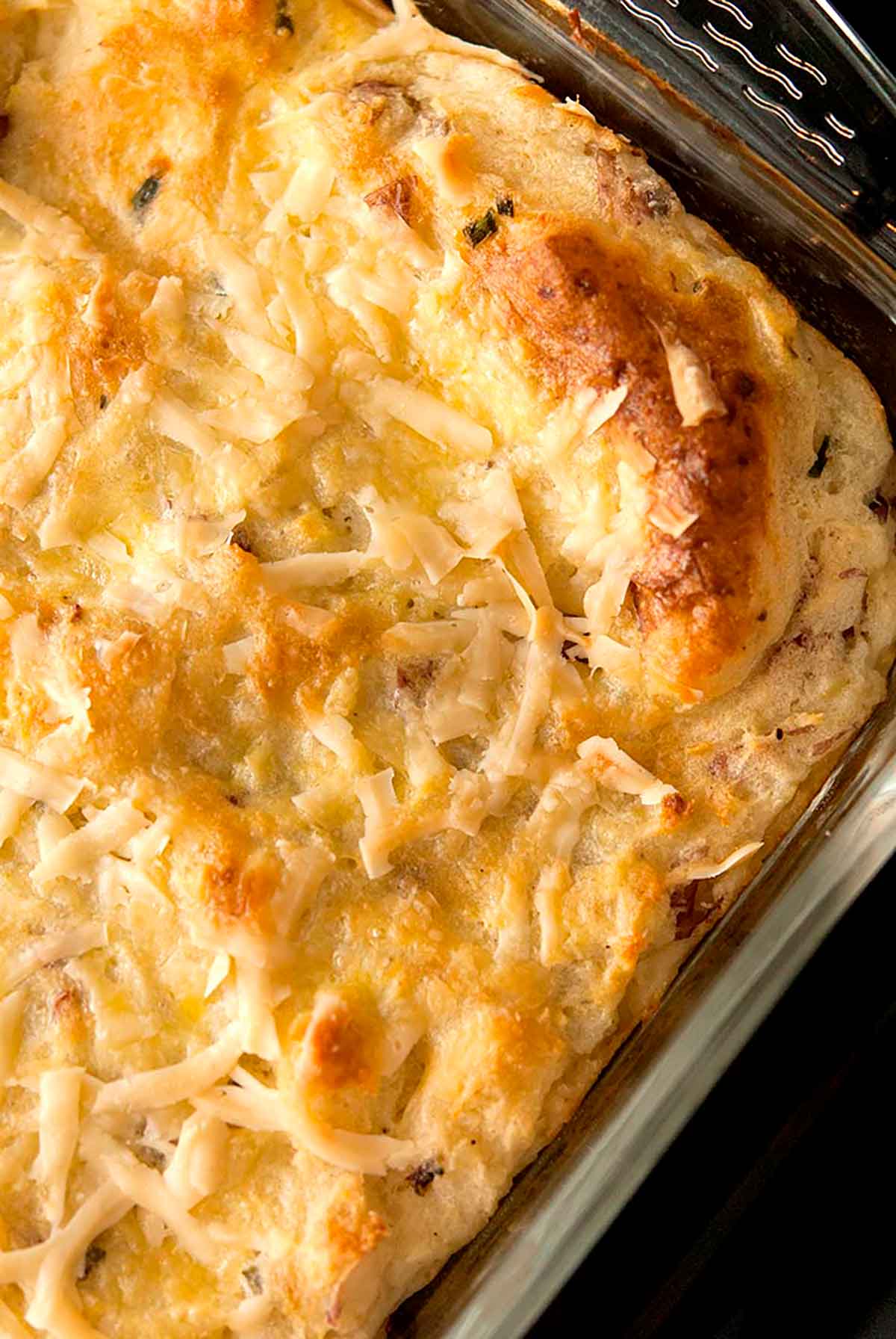 Baked masked potatoes in a pyrex dish.