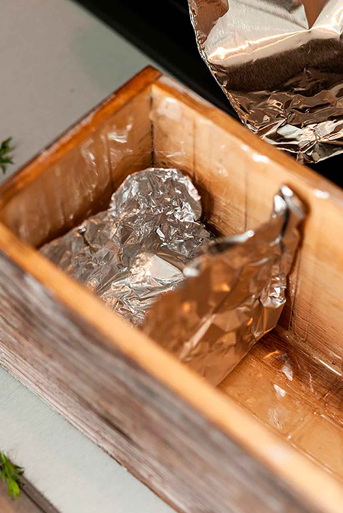 A flower box with a tin foil divider.