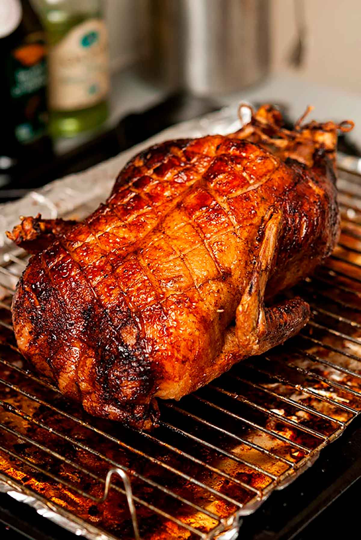 A roasted duck on a baking pan.