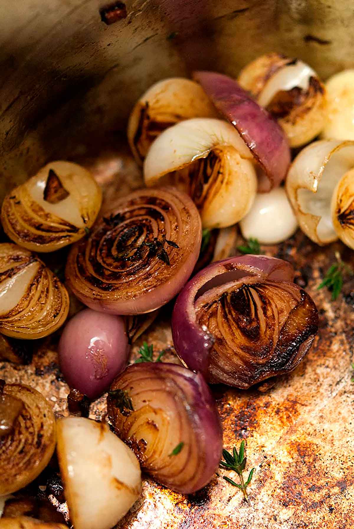Browned pearl onions in a pot.