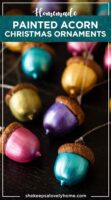 12 painted acorn ornaments on a table, in different colors.