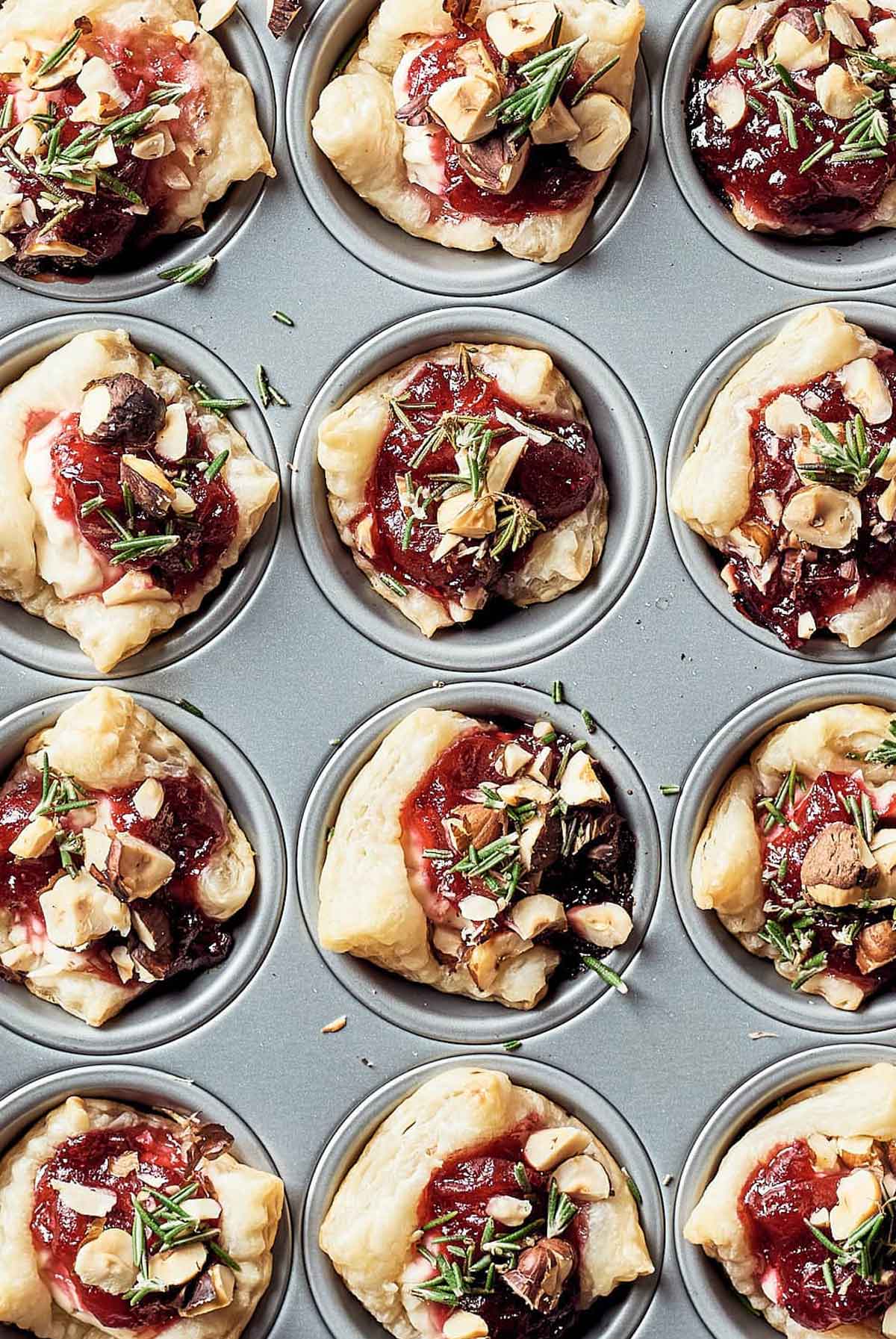 12 Cranberry puff bites in a mini-cupcake tin.