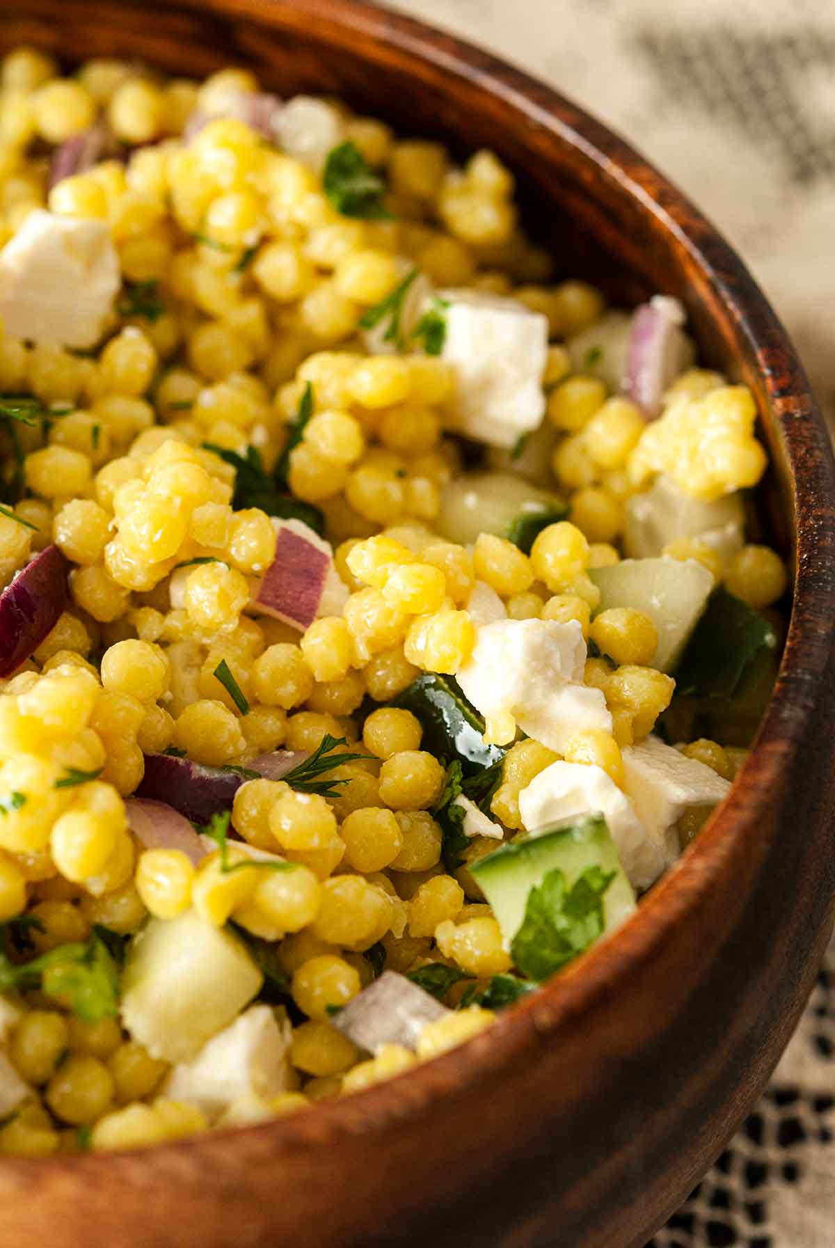 A bowl of turmeric pearl couscous.