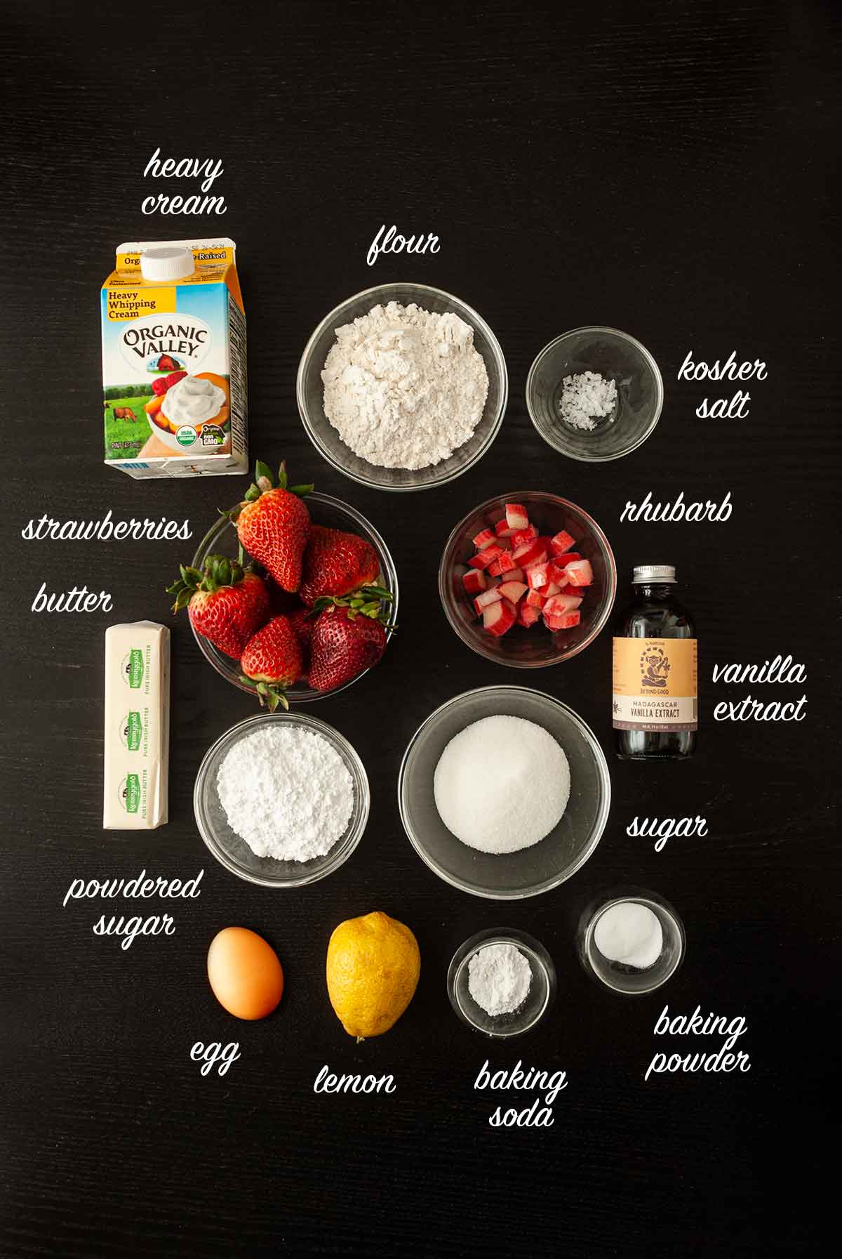 Ingredients on a dark table with titles for each ingredient.