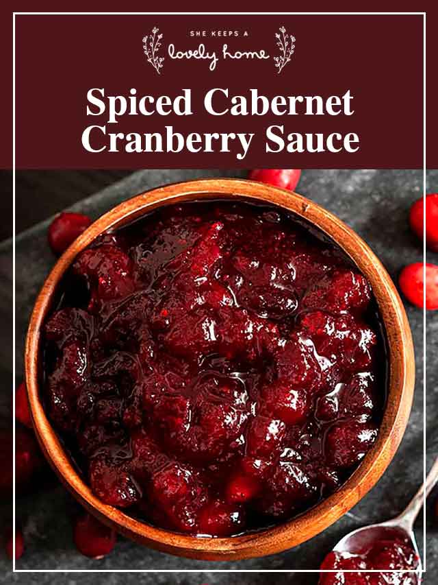 Cranberry sauce in a wooden bowl with a title that says "Spiced Cabernet Cranberry Sauce."