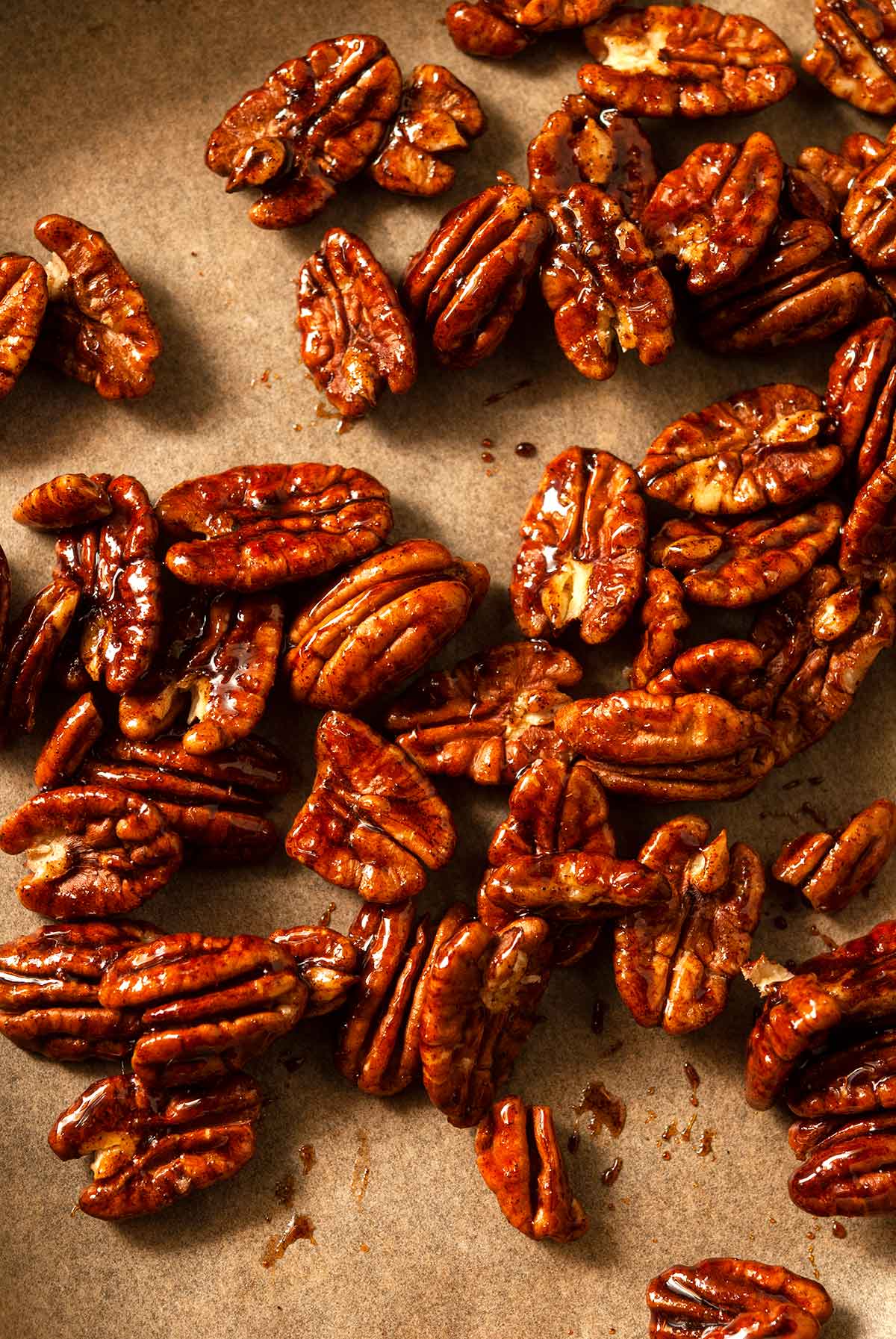 Candied pecans on parchment paper.