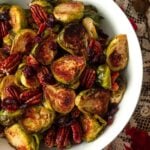 A bowl of Brussels sprouts, bacon, cranberries and pecans.