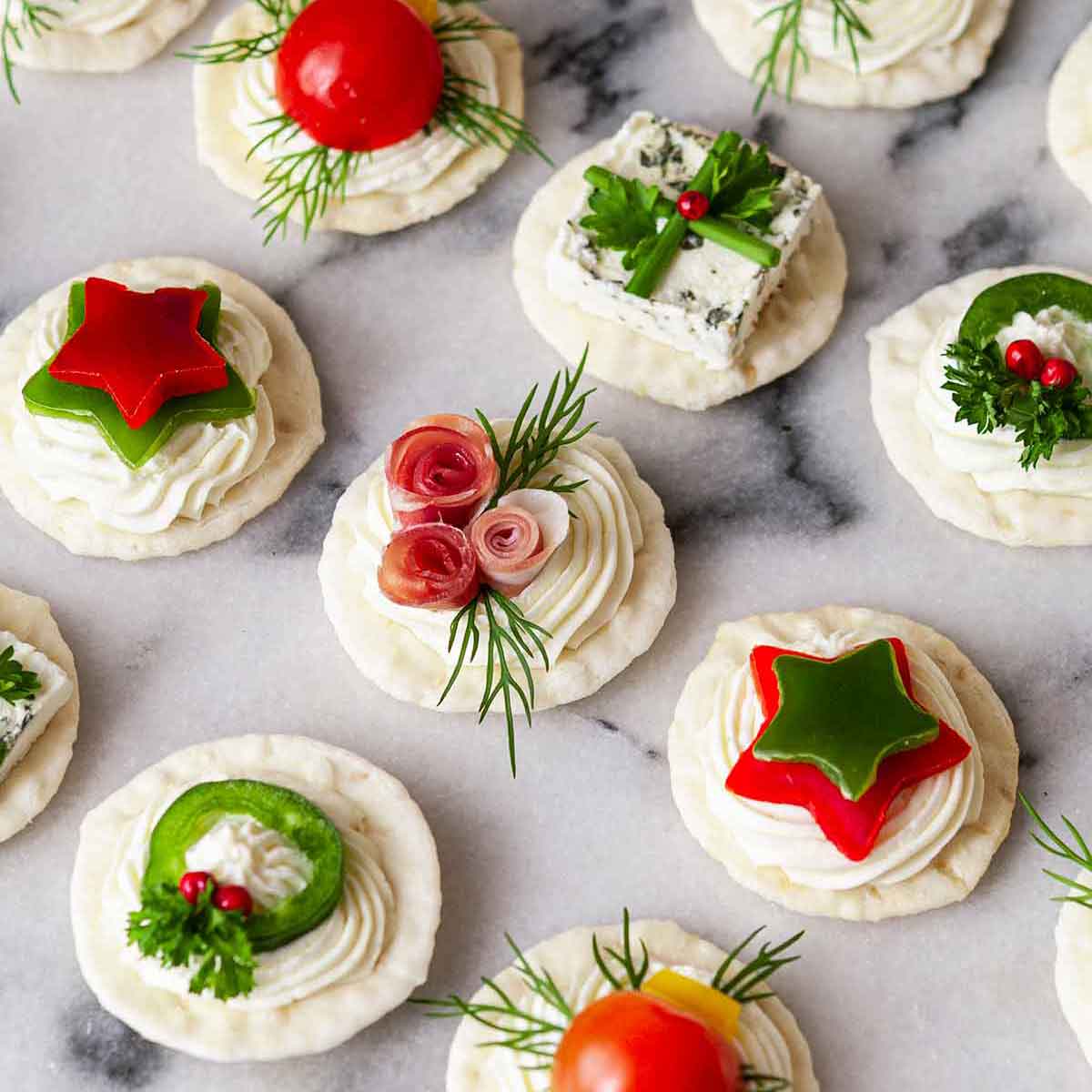 An assortment of festive appetizers on marble.