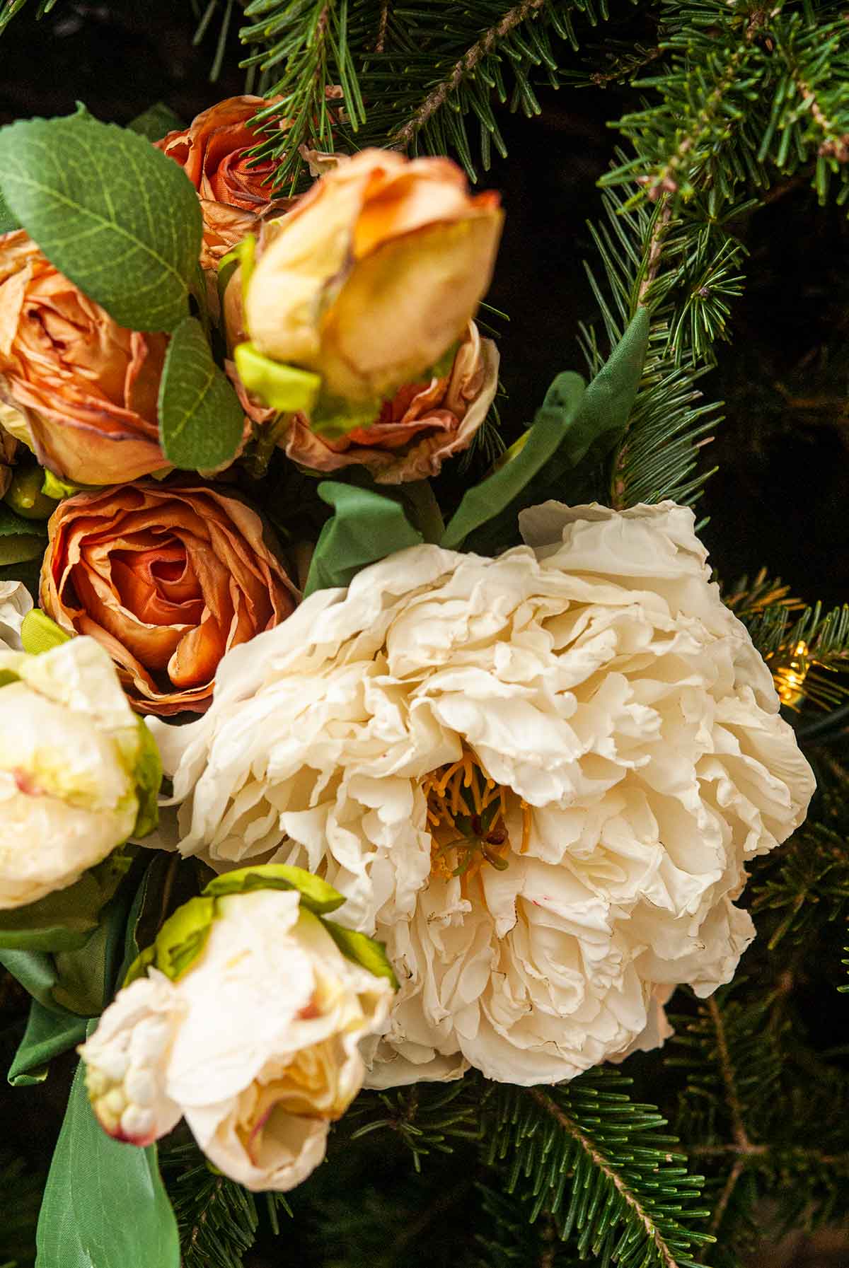 Artificial peonies and roses in a Christmas tree..