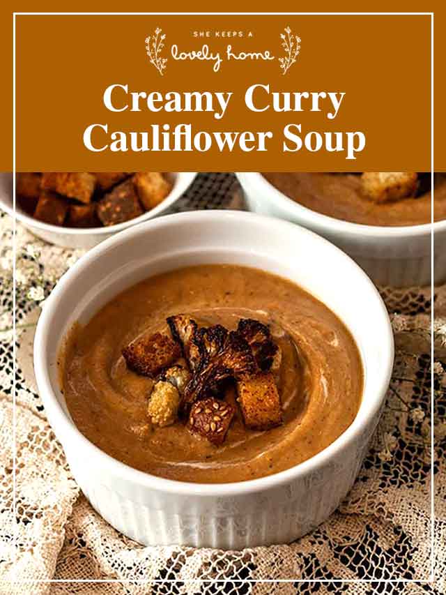 A bowl of cauliflower soup with a title that says "Creamy Curry Cauliflower Soup.