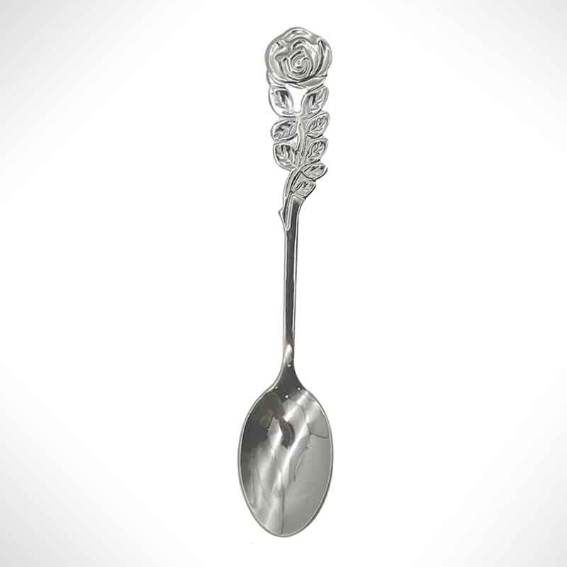 A small spoon with a rose detail.