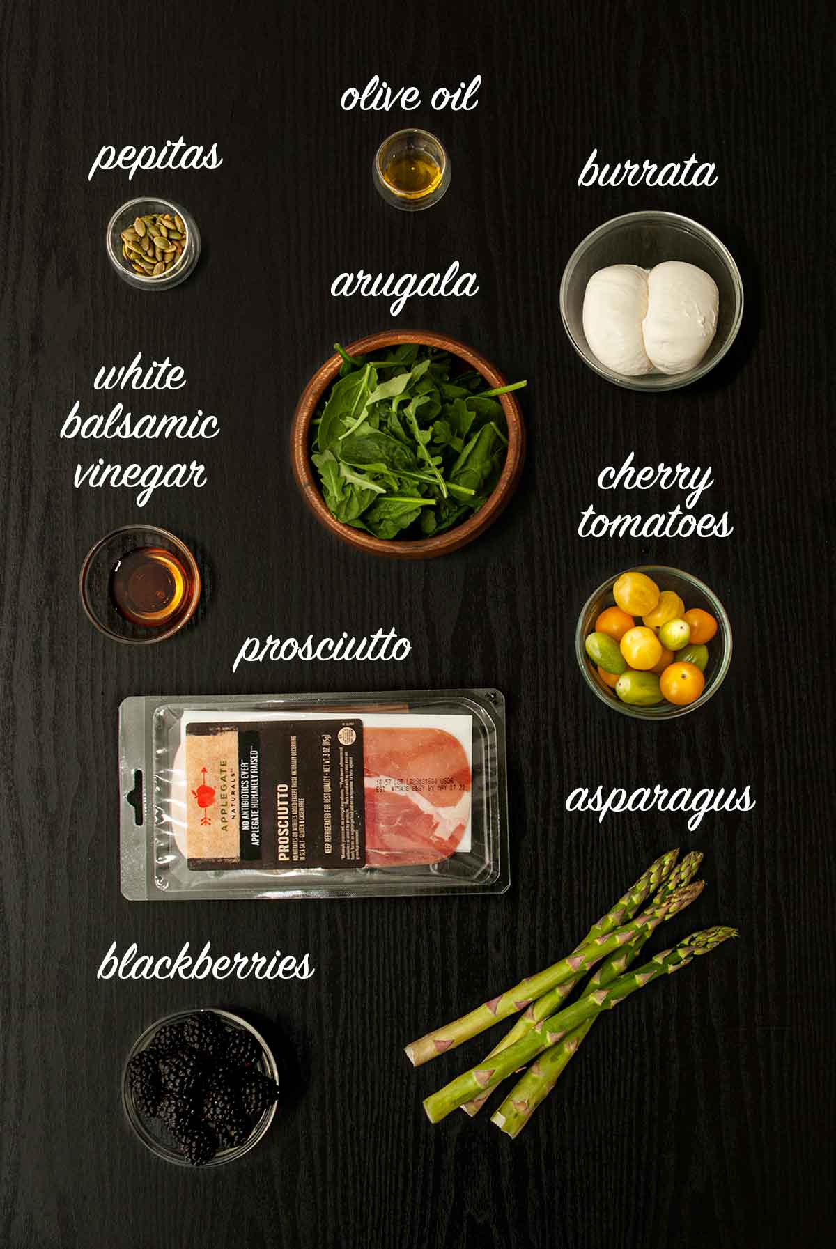 9 ingredients for making burrata salad with balsamic glaze on a table.