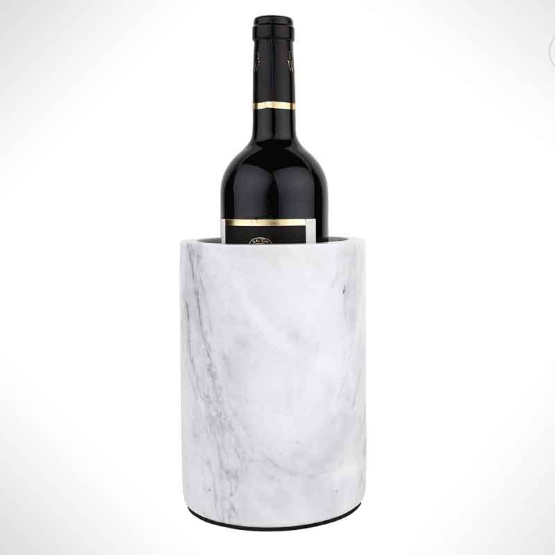 A wine bottle in a marble cooler on white.