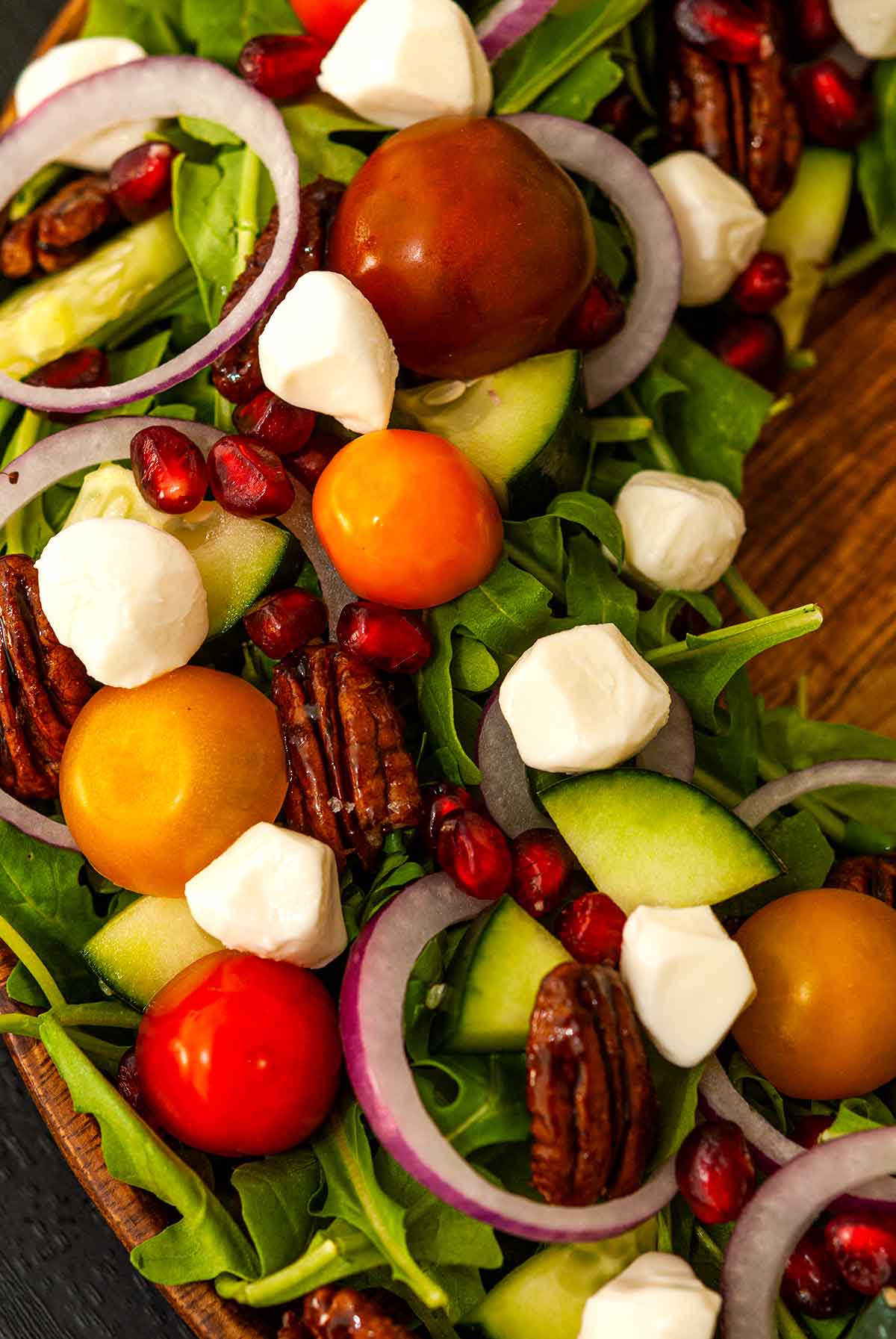 the sliced vegetables and cheese on a Christmas salad.