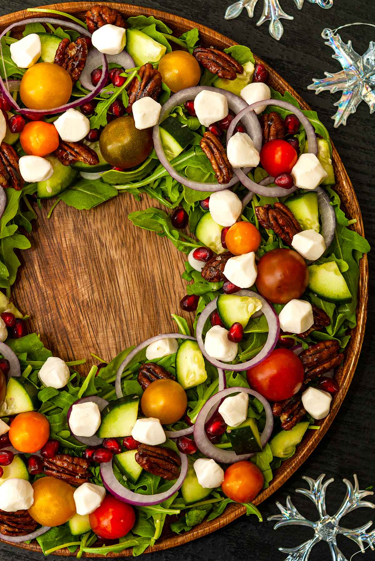 A festively assembled Christmas salad in the shape of a wreath.