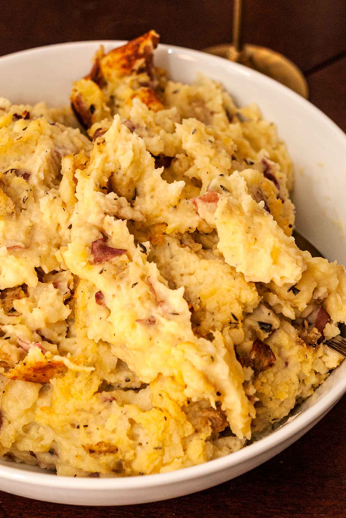 A bowl of baked mashed potatoes.