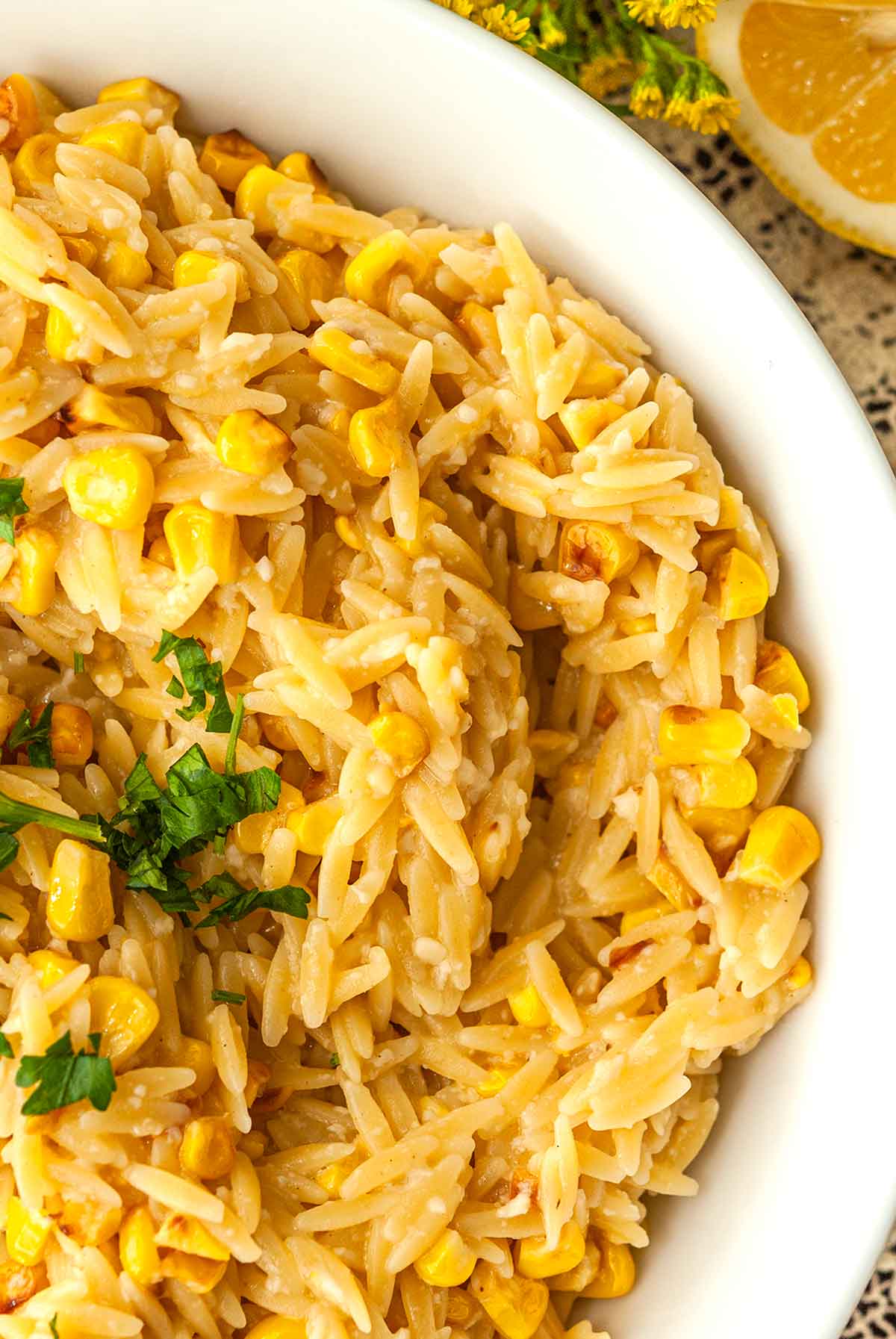 The corn and pasta in a bowl of lemon orzo.