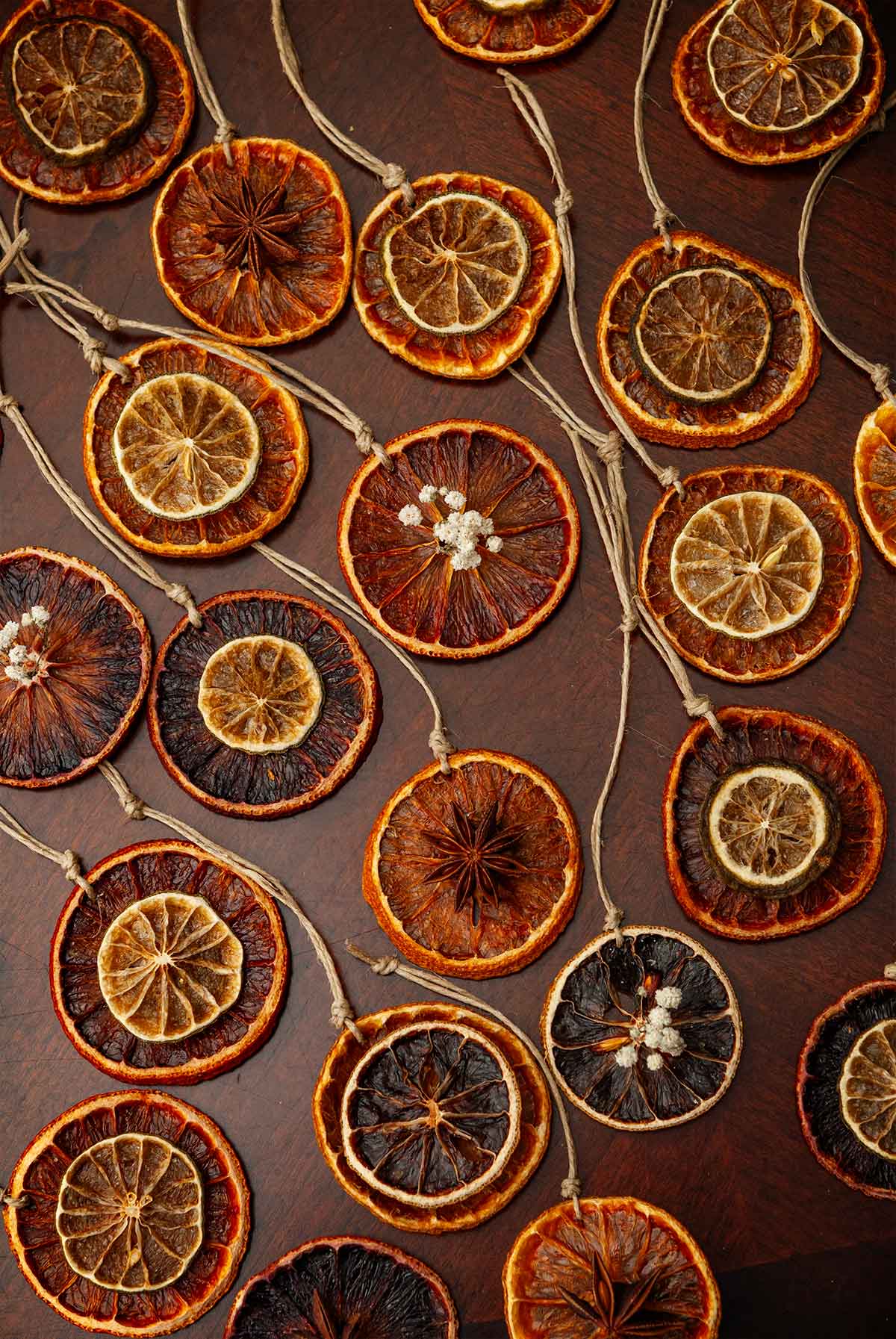 21 citrus ornaments on a table.