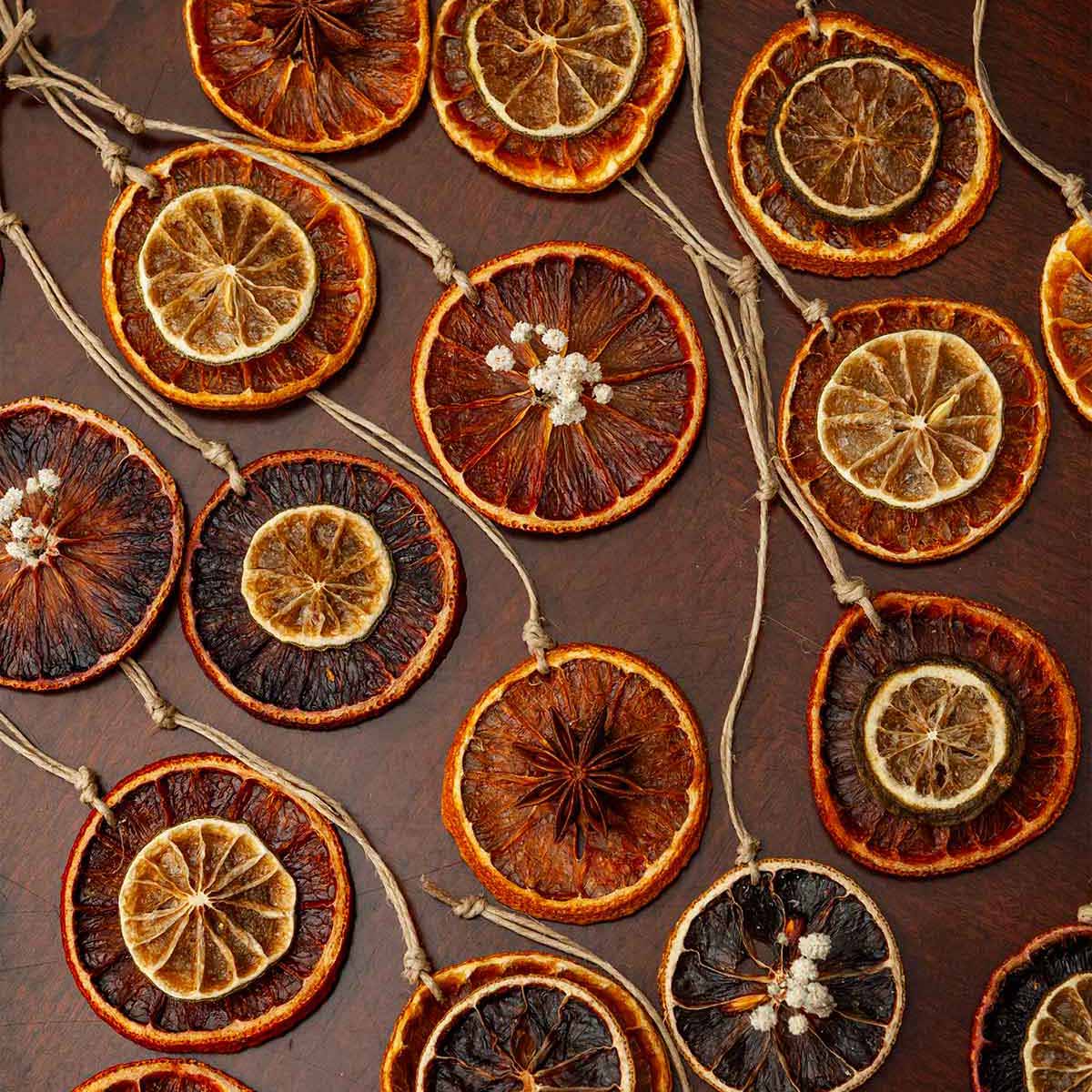 21 citrus ornaments on a table.