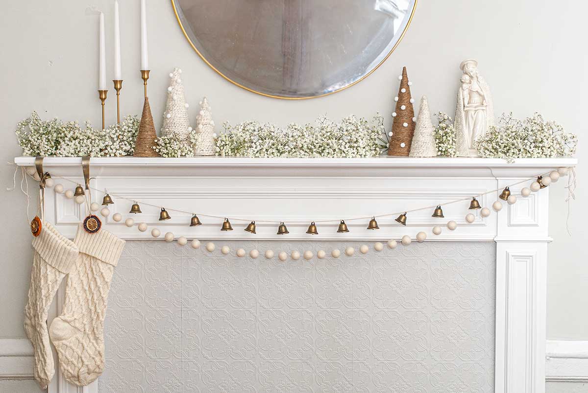 A minimally designed Christmas mantle with baby's breath.