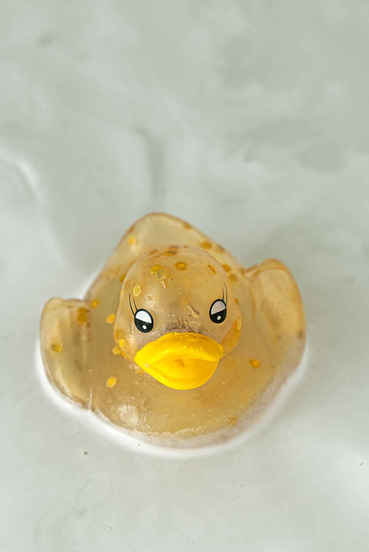 A rubber duck in froth.