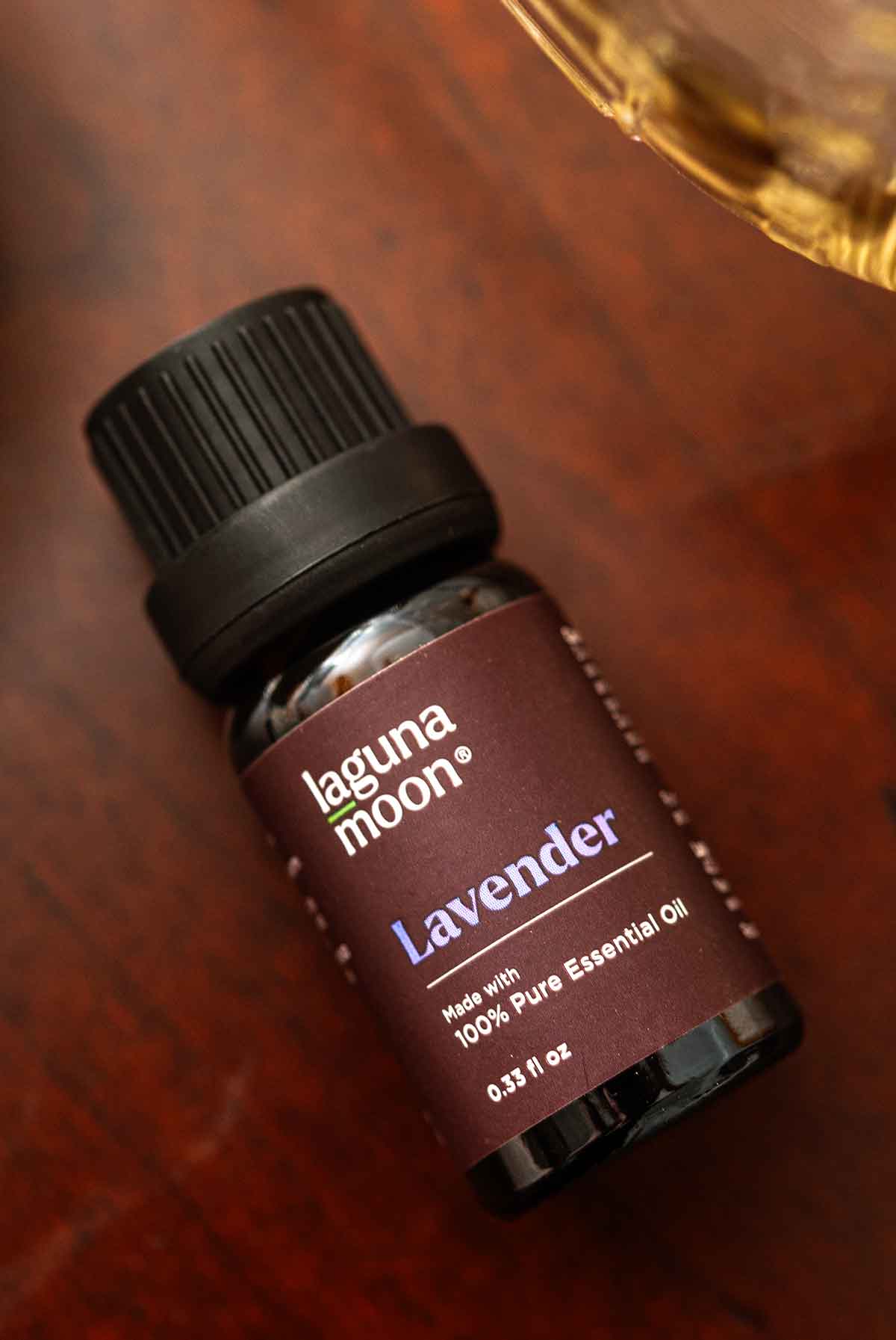 A small jar of Lagoonamoon Lavender oil on a table.