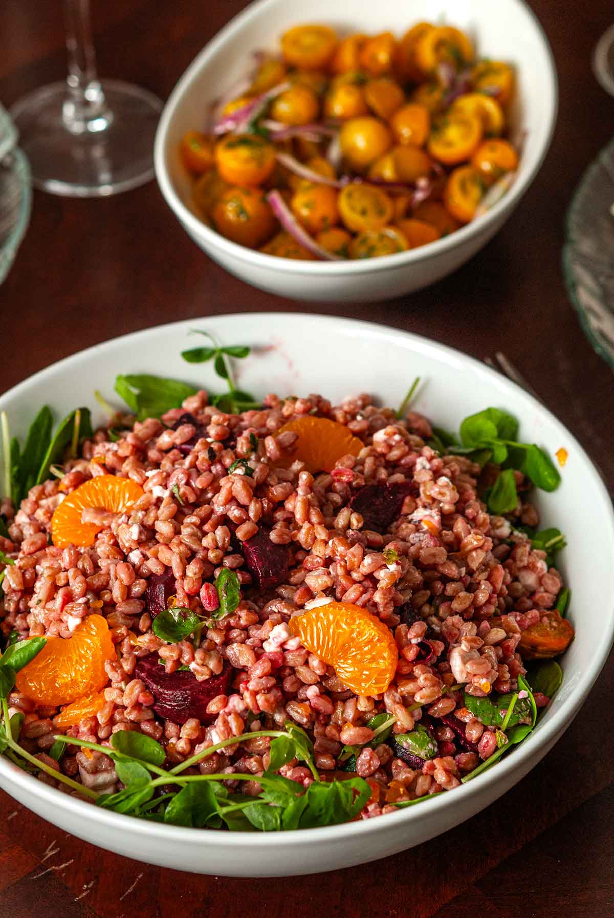 A bowl of farro with beets and mandarins.