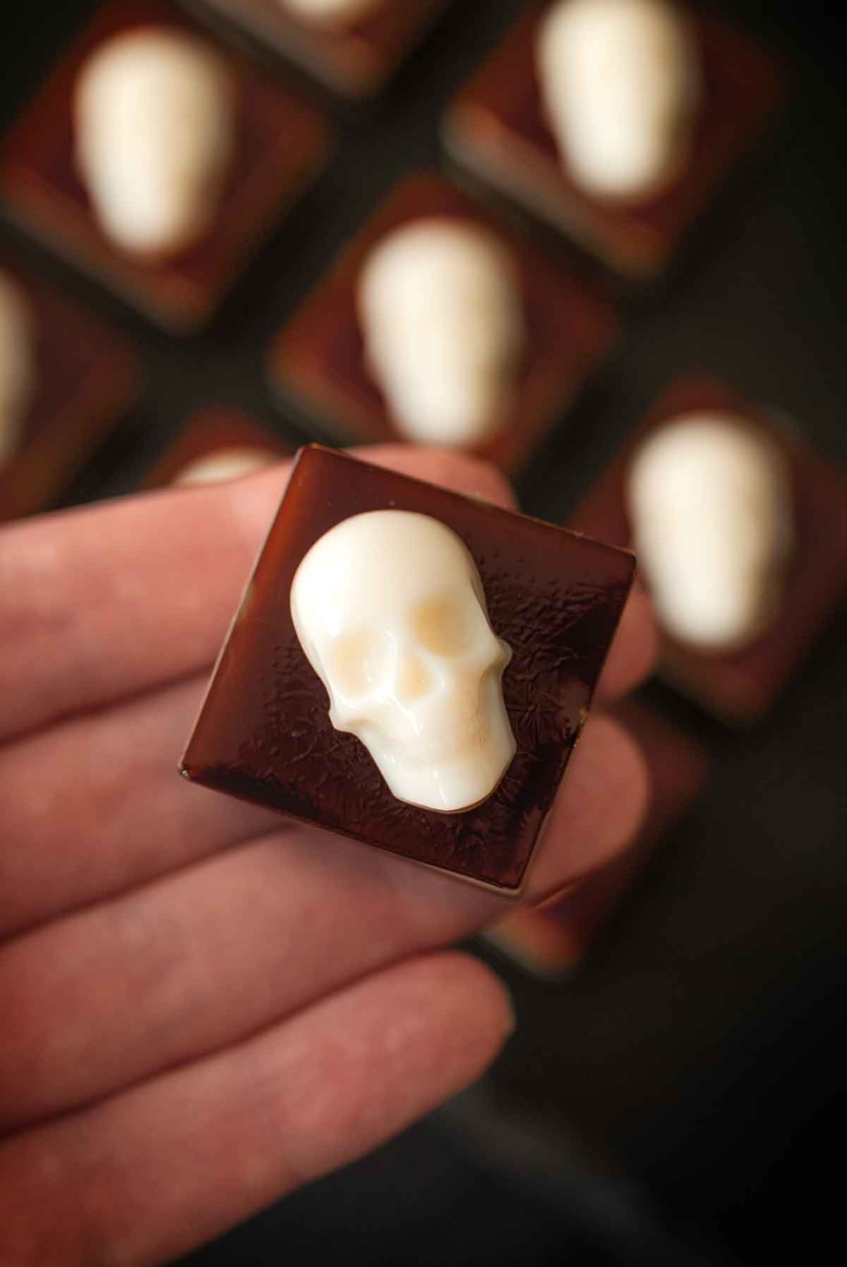 1 skull jello shot held by a hand.