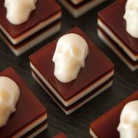 6 skull jello shots on a plate.